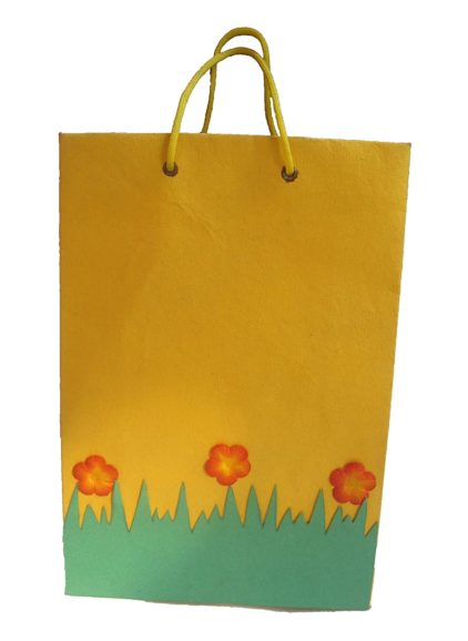 Handmade paper bag with gold screen printing.